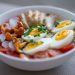 Bowl of noodles with chicken, eggs, and vegetables